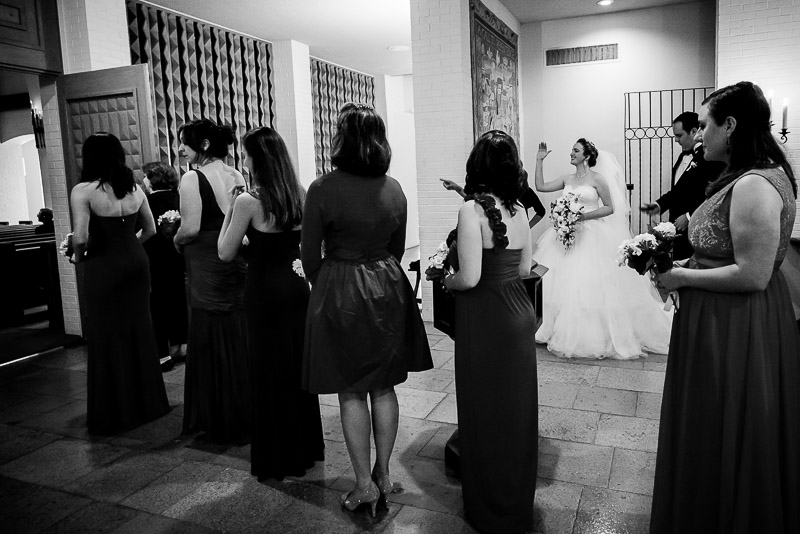 Bride waves as wedding ceremony gets under way at Margarite B. Parker Chapel