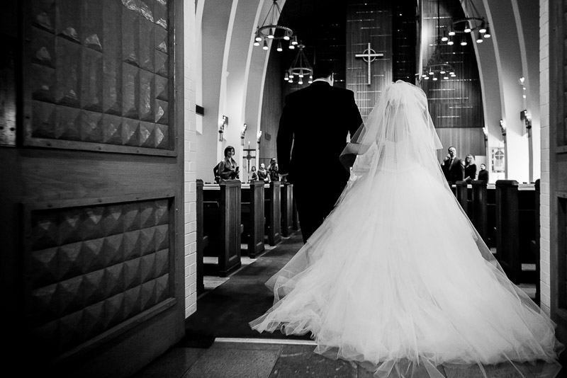 Father and bride walk down the aisle at Margarite B. Parker Chapel