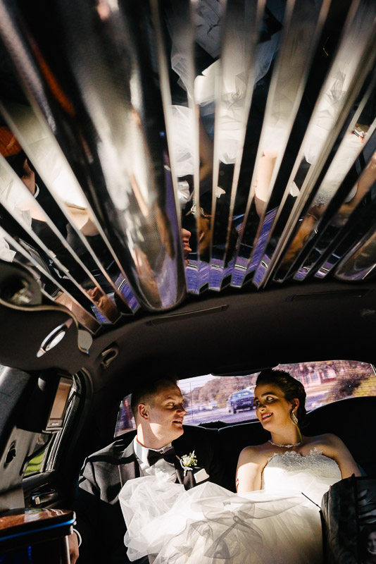 Couple in limo with reflection