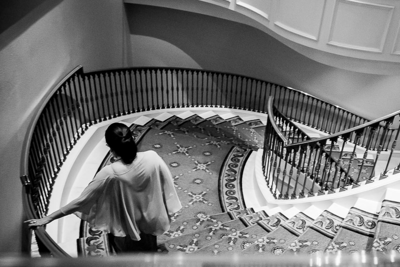 Bridesmaid descends staircase at The Westin Riverwalk, San Antonio, Texas