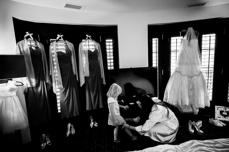 Bride dressing flower girl at The Valencia Hotel, San Antonio