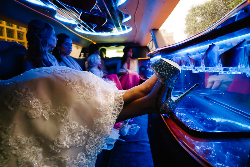 The brides gorgeous shoes inside a limo