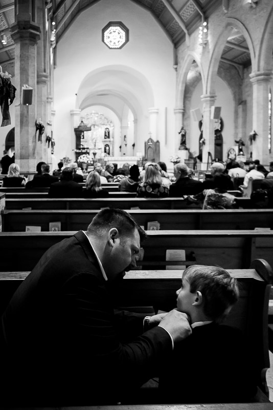 RIngebearer has his tie fixed by dad at San Fernando Cathedral