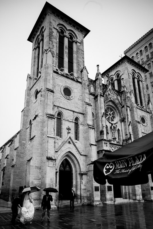 Bride leaving limo and walking up to San Fernando Cathedral, San Antonio, Texas