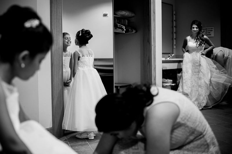 Daughters of the bride with bride look in the mirror at Los Encinos Wedding venue