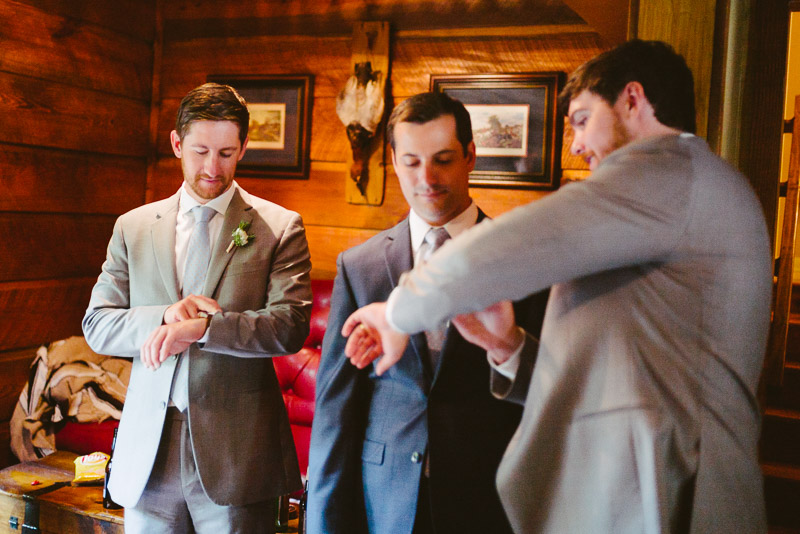 Groom and groomsmen check their watches Madera Estates-Philip Thomas