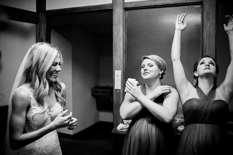 Jokes are shared between bride and bridesmaids at St. Paul's United Methodist Church Houston Wedding-Hobby Center Wedding Houston-Philip Thomas