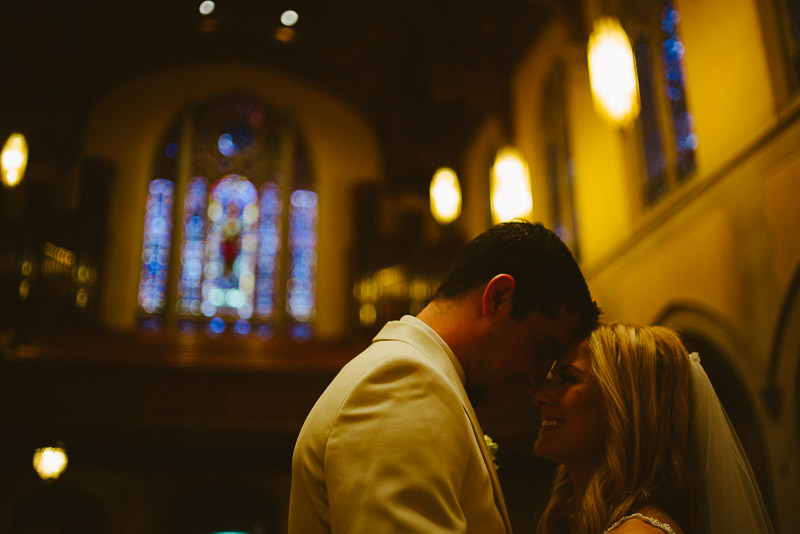 Bride and groom pose in low light at St. Paul's United Methodist Church Houston Wedding-Hobby Center Wedding Houston-Philip Thomas