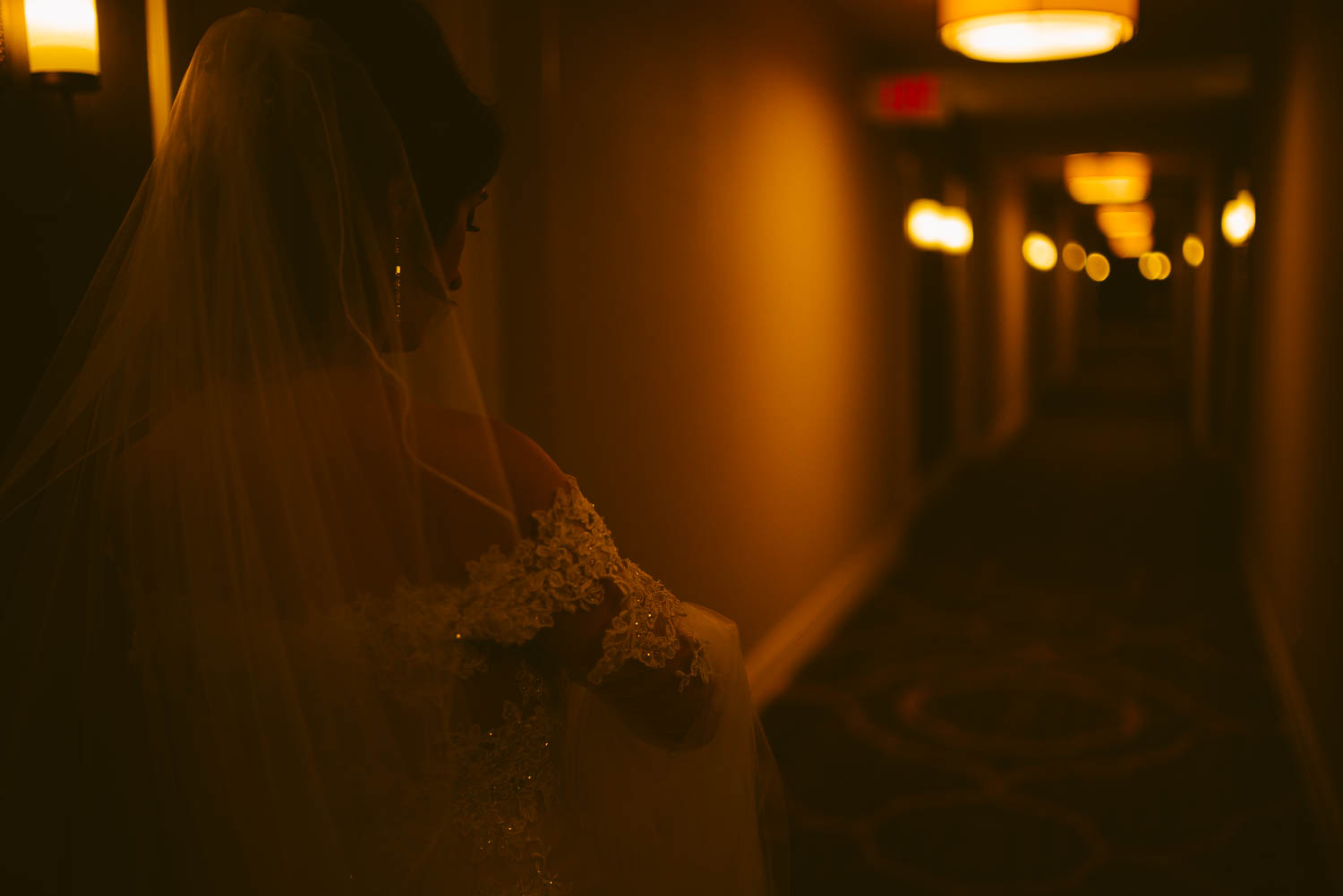 Bride leaves hotel room corridor on way to ceremony la-cantera-resort-wedding-photographer-philip-thomas