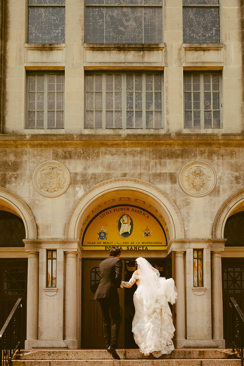 Couple arrive at Basilica of little flower up steps San Antonio Texas