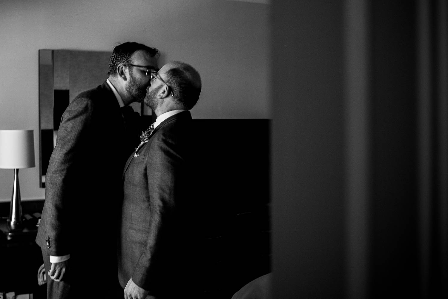 same-sex-couple steal a kiss at wedding-marina-del-rey-marriott-los-angeles-leica-wedding-photographer-philip-thomas