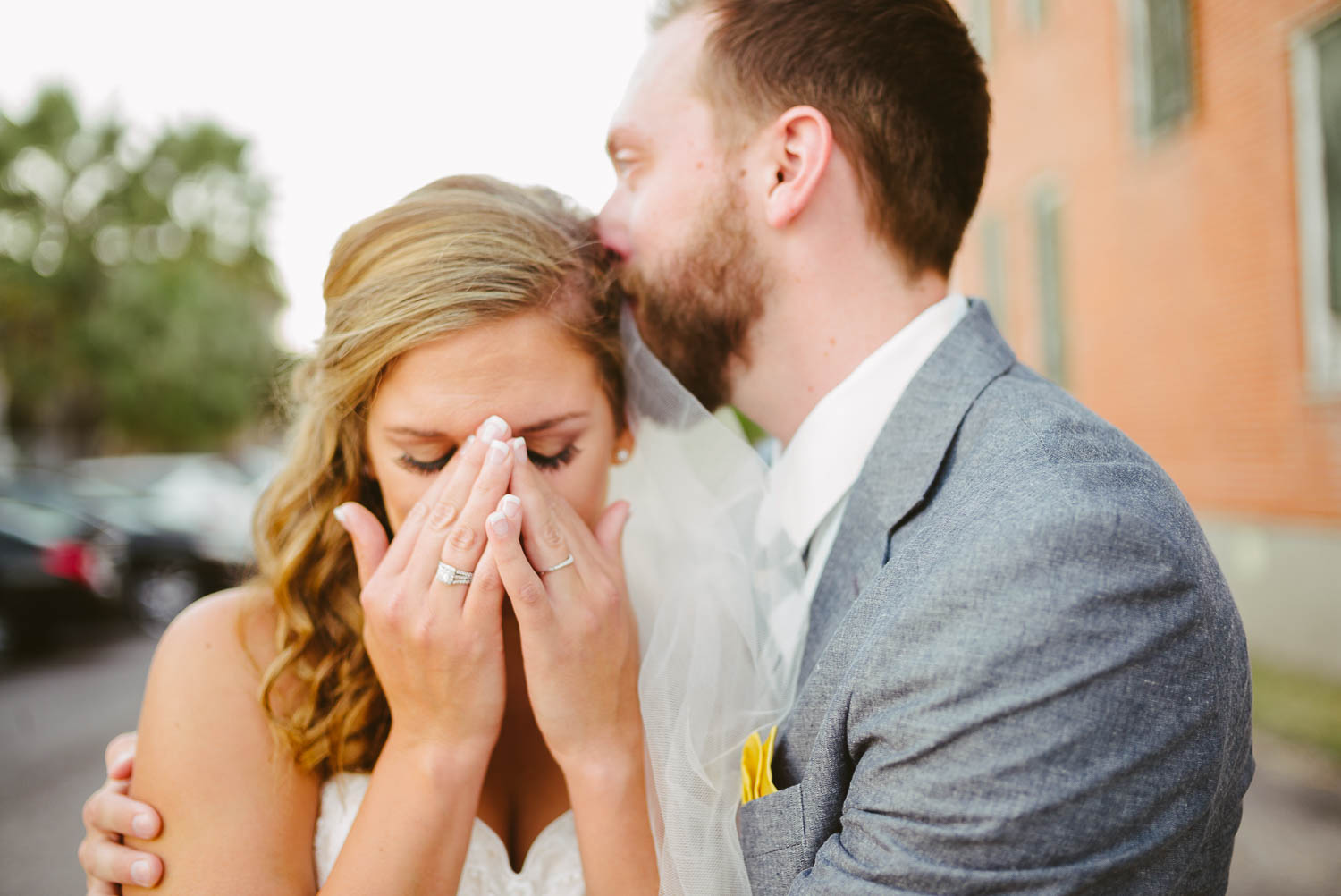 Groom comforts bride on their wedding day as the emotion of the day overwhelms her. Photographed at the The Lyceum Houston, Texas with a Leica M(240)