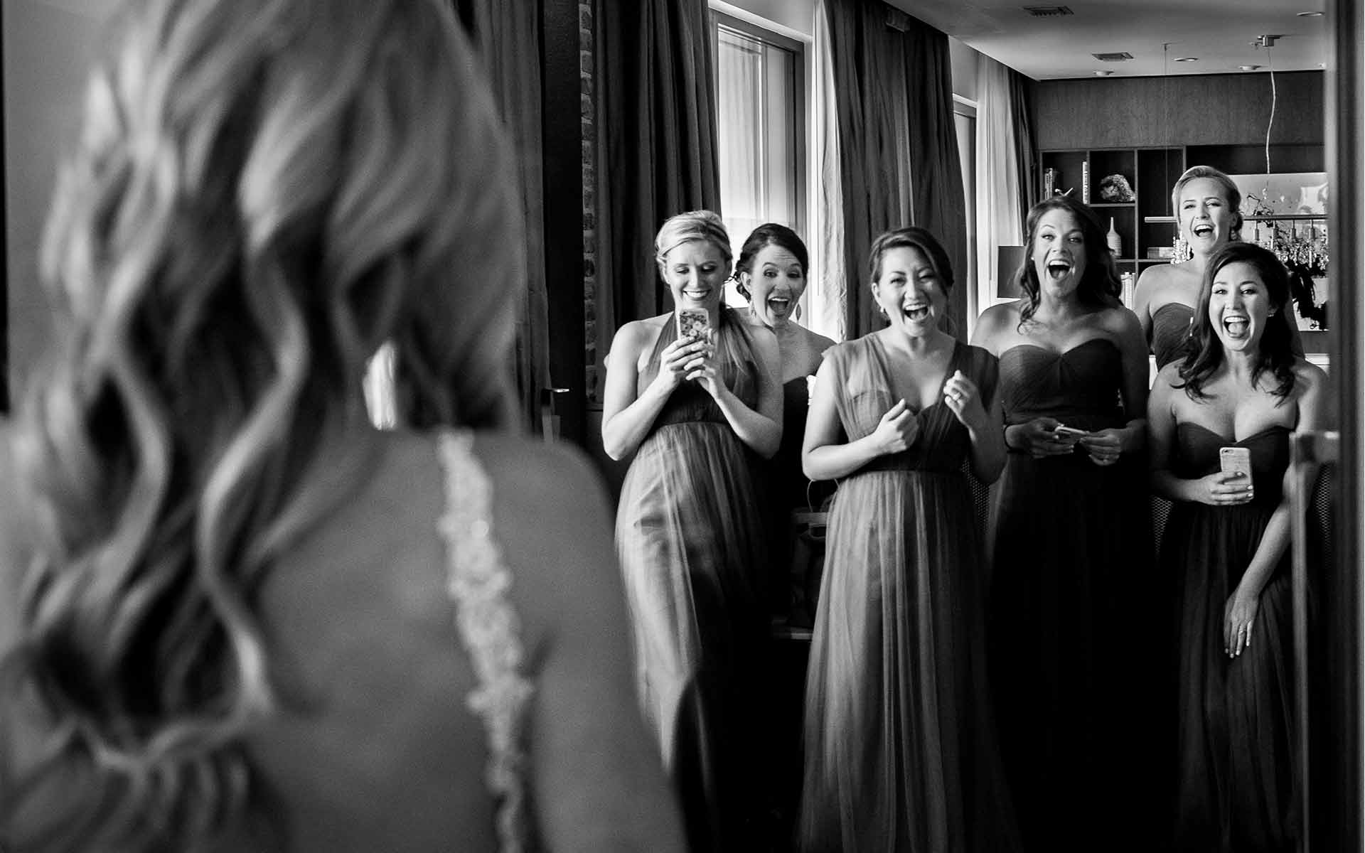 A bride on her wedding day is revealed to bridesmaids and the reaction is priceless