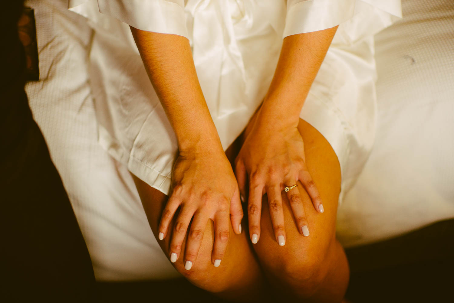 brides hands rest on thighs at immaculate-heart-of-mary-church-philip-thomas-photography