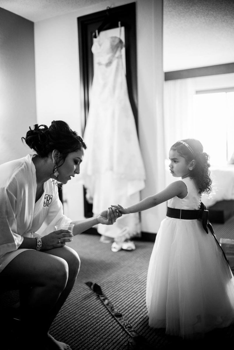 Brides daughter holds her mothers hand-immaculate-heart-of-mary-church-philip-thomas-photography