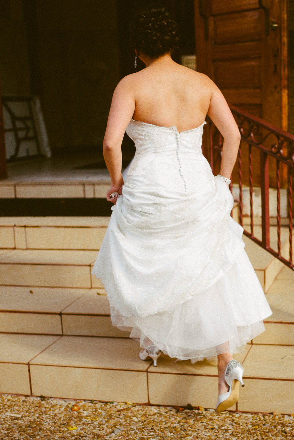 Bride walks up stairs to immaculate-heart-of-mary-church-philip-thomas-photography