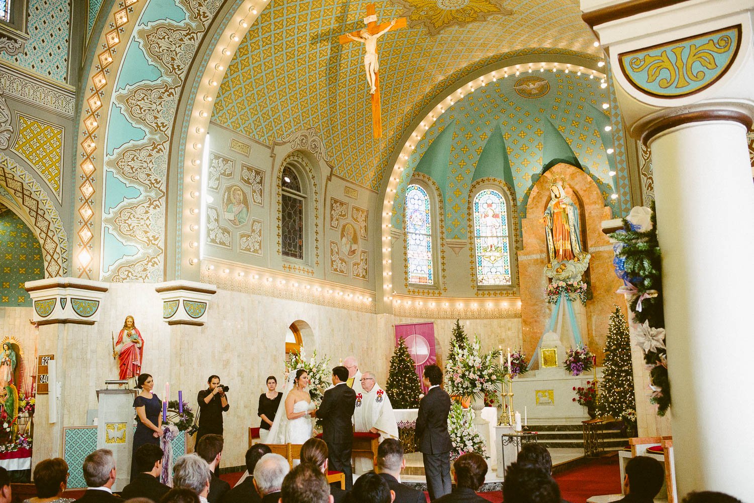 wide angle shot of bride and groom wedding ceremony at immaculate-heart-of-mary-church-philip-thomas-photography