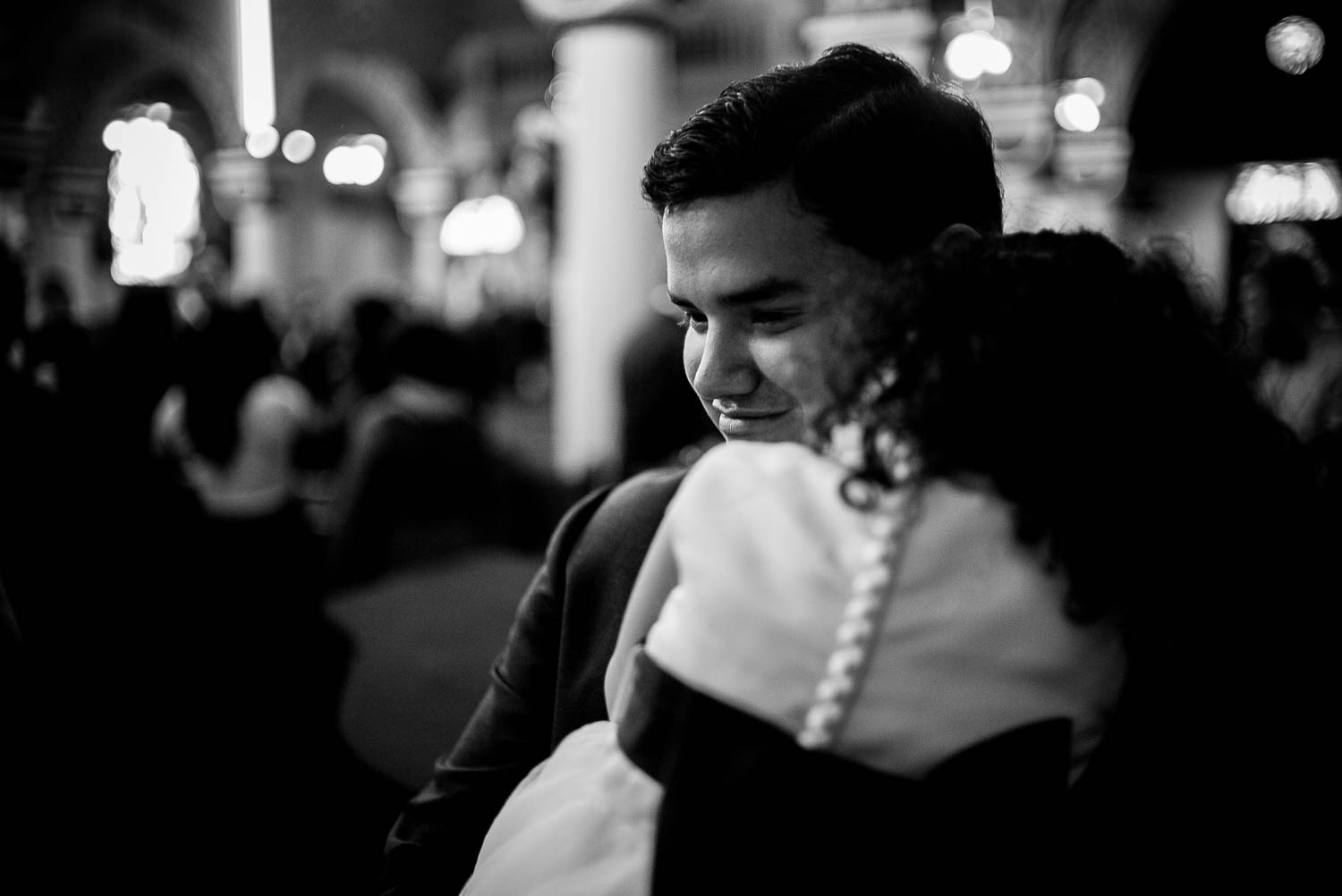 Groom hugs his daughter in a beautiful moment at immaculate-heart-of-mary-church-philip-thomas-photography