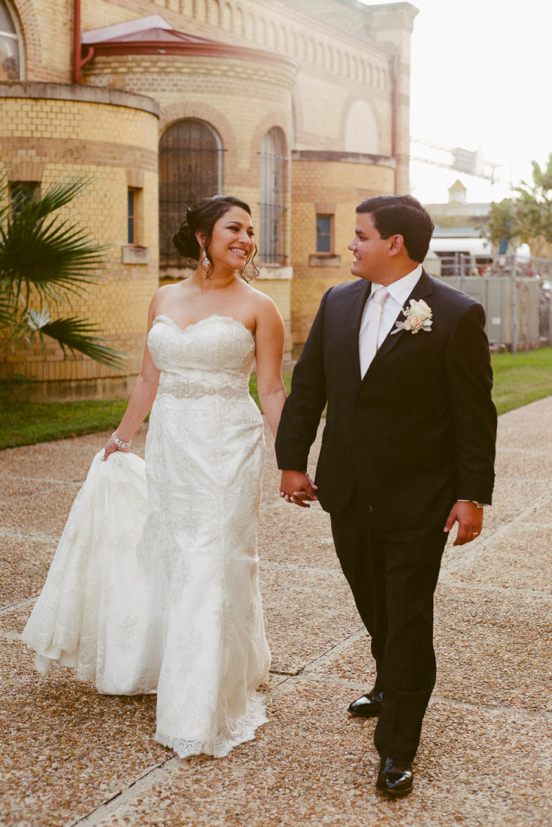 Couple walk along side the immaculate-heart-of-mary-church-philip-thomas-photography