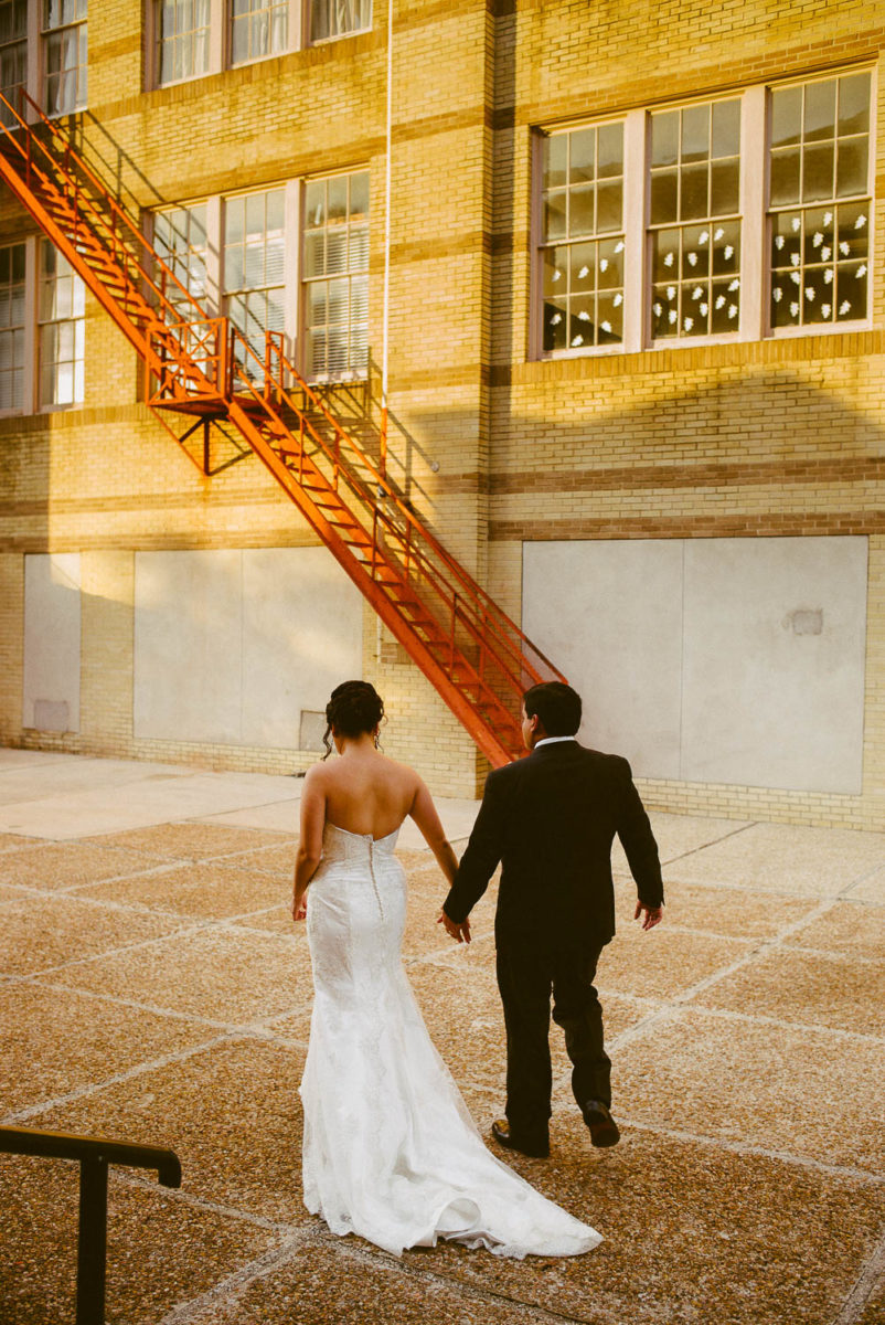 Couple walk off in angular light at immaculate-heart-of-mary-church-philip-thomas-photography