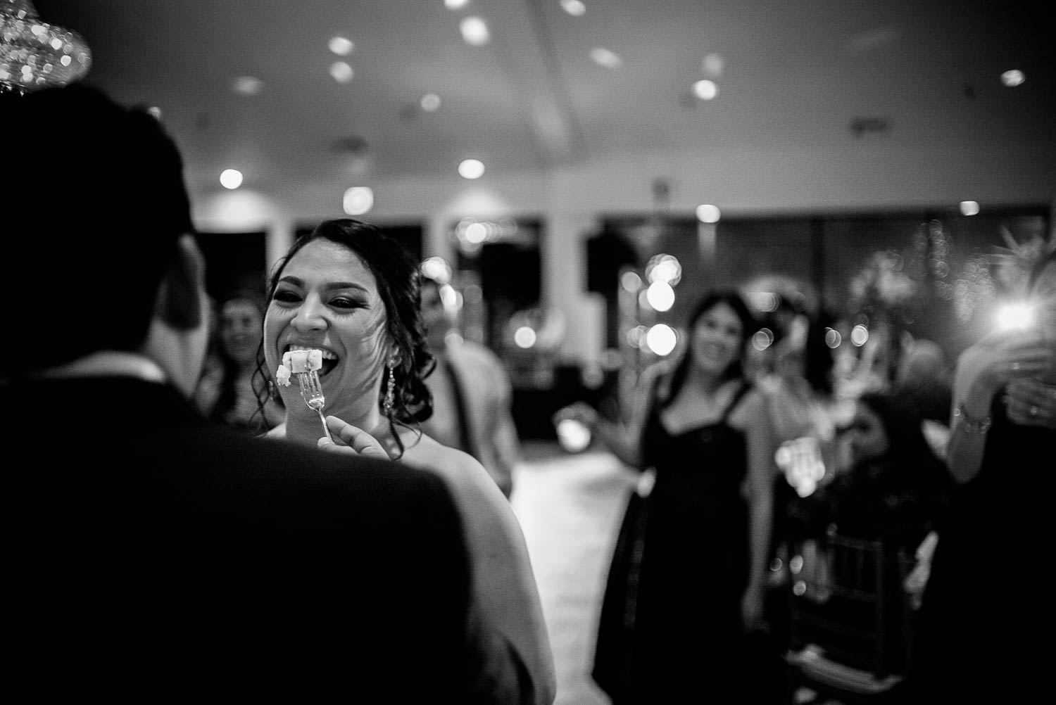 Groom feeds cake to bride during cutting the cake at Granberry Hills Wedding, Philip Thomas Photography