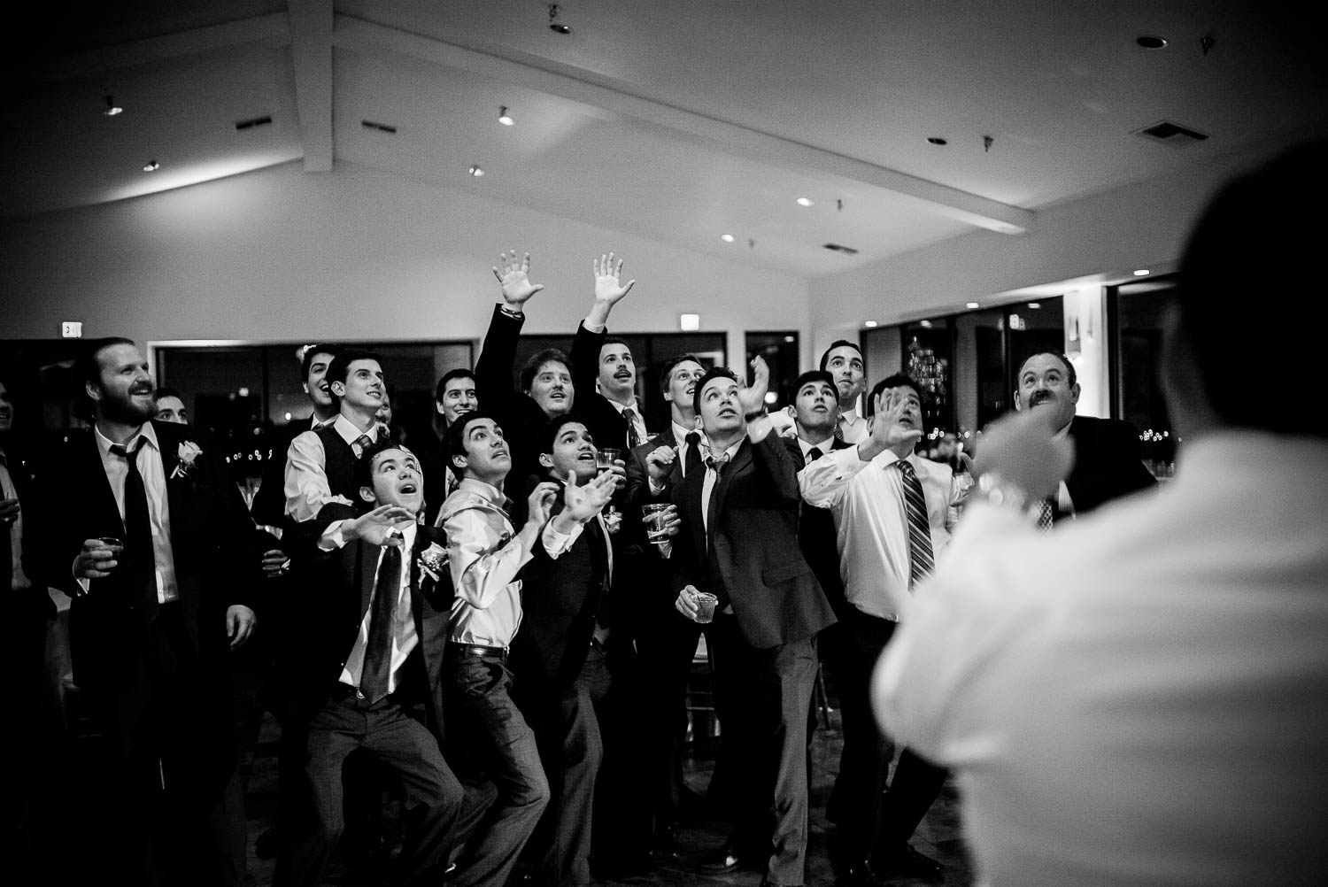 Single guys jump to collect garter during wedding reception Granberry Hills Wedding, Philip Thomas Photography