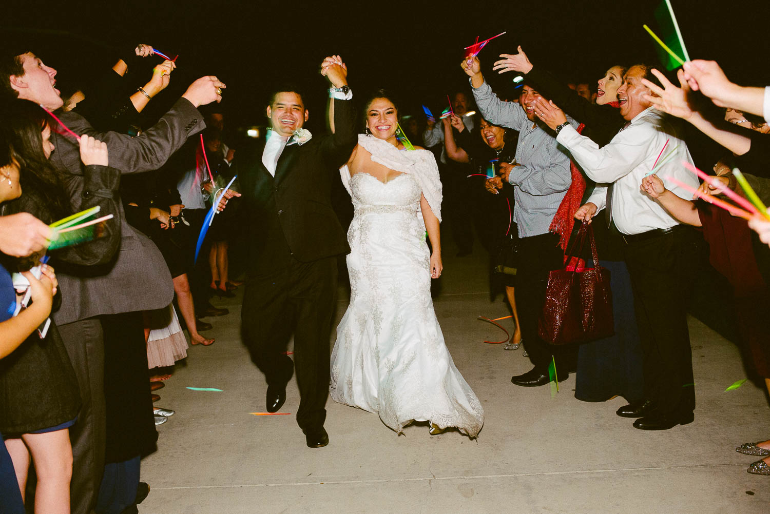 Couple depart from wedding reception and glow sticks at Immaculate Heart, Granberry Hills Wedding, Philip Thomas Photography