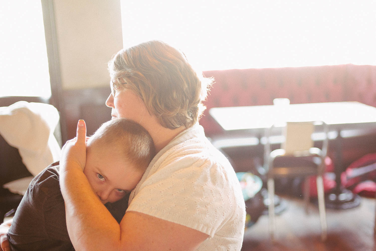 Cute nephew hugs grandma at a wedding rehearsal in Takoma, Washington D.C