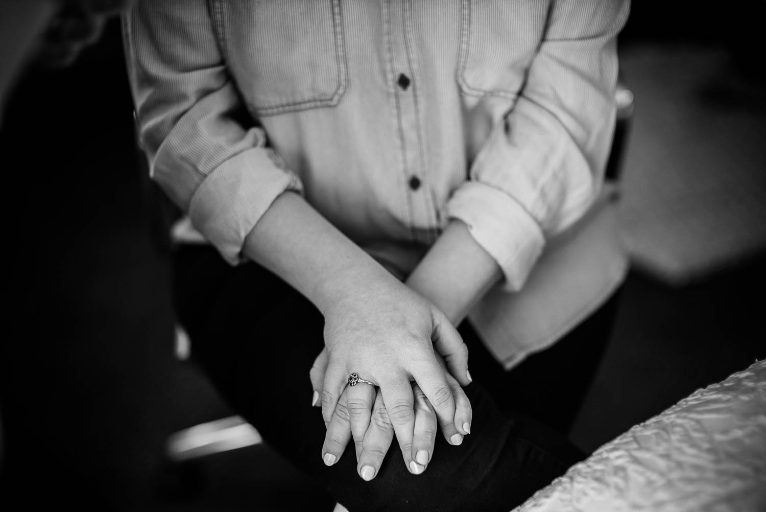 Brides pensive hands as she gets ready for her wedding day at Takoma Park Washington DC Wedding