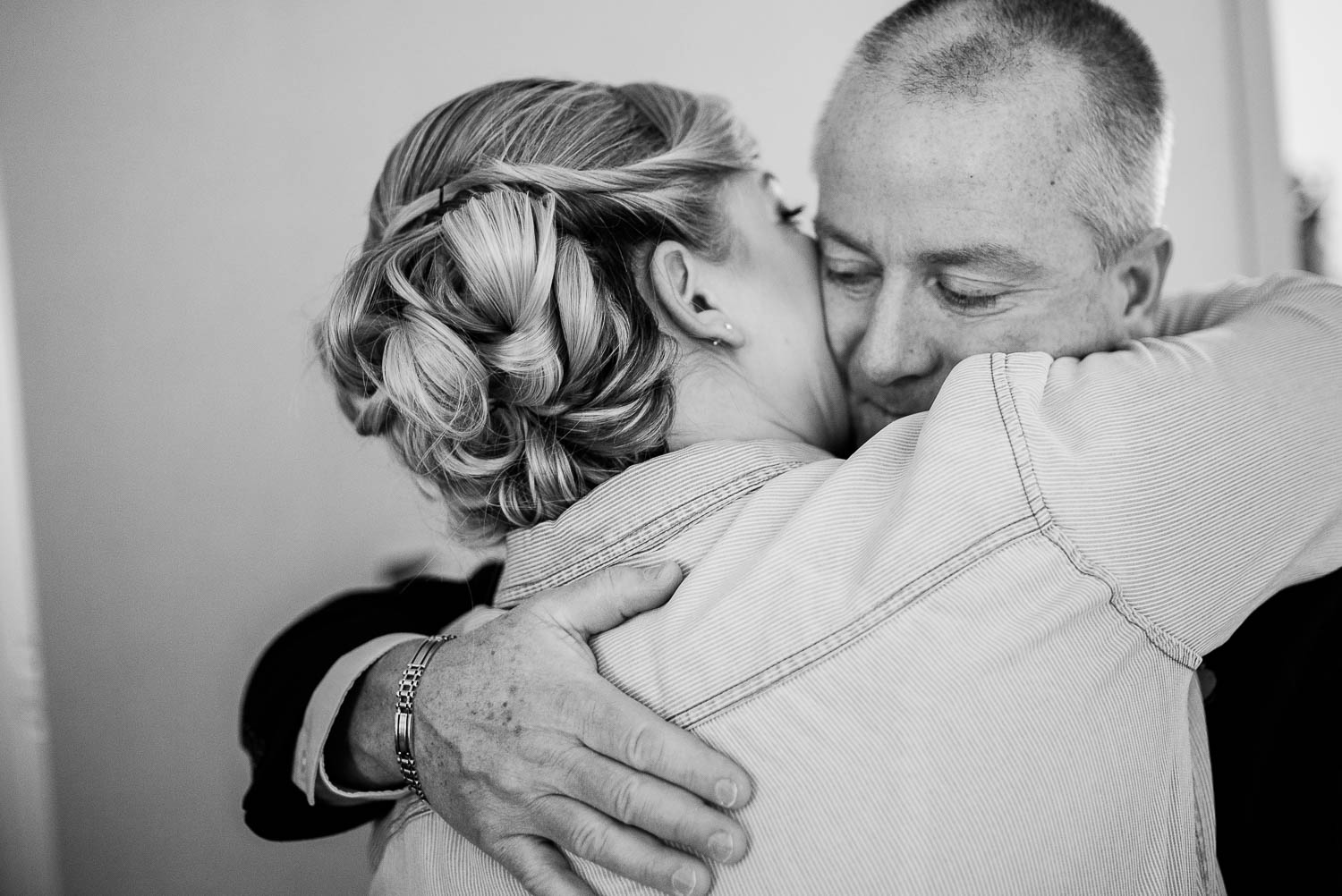 Father of the bride hugs his daughter on her wedding day at Takoma Park Washington D.C-Leica Wedding photographer-Philip Thomas