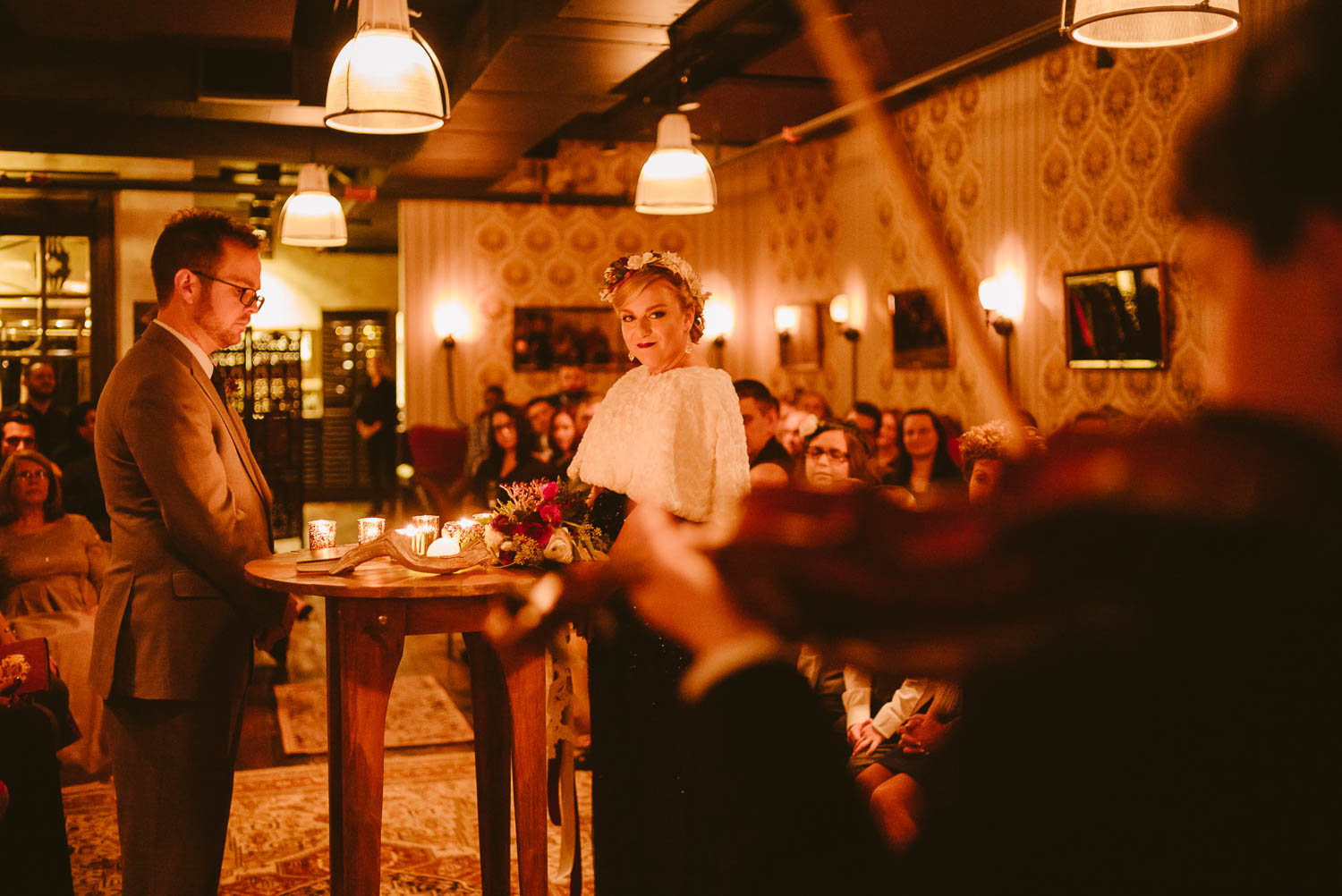 During wedding ceremony a young boy plays the violin at Republic Takoma Park Washington D.C-Leica Wedding photographer-Philip Thomas