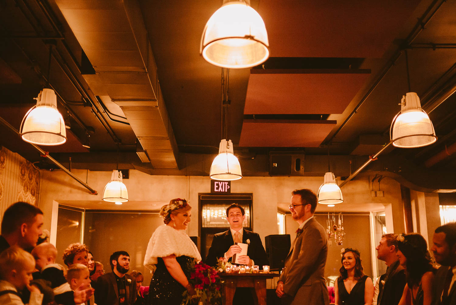 Couple face each other during wedding vows in beautiful low light ceremony at Republic Takoma Park Washington D.C-Leica Wedding photographer-Philip Thomas