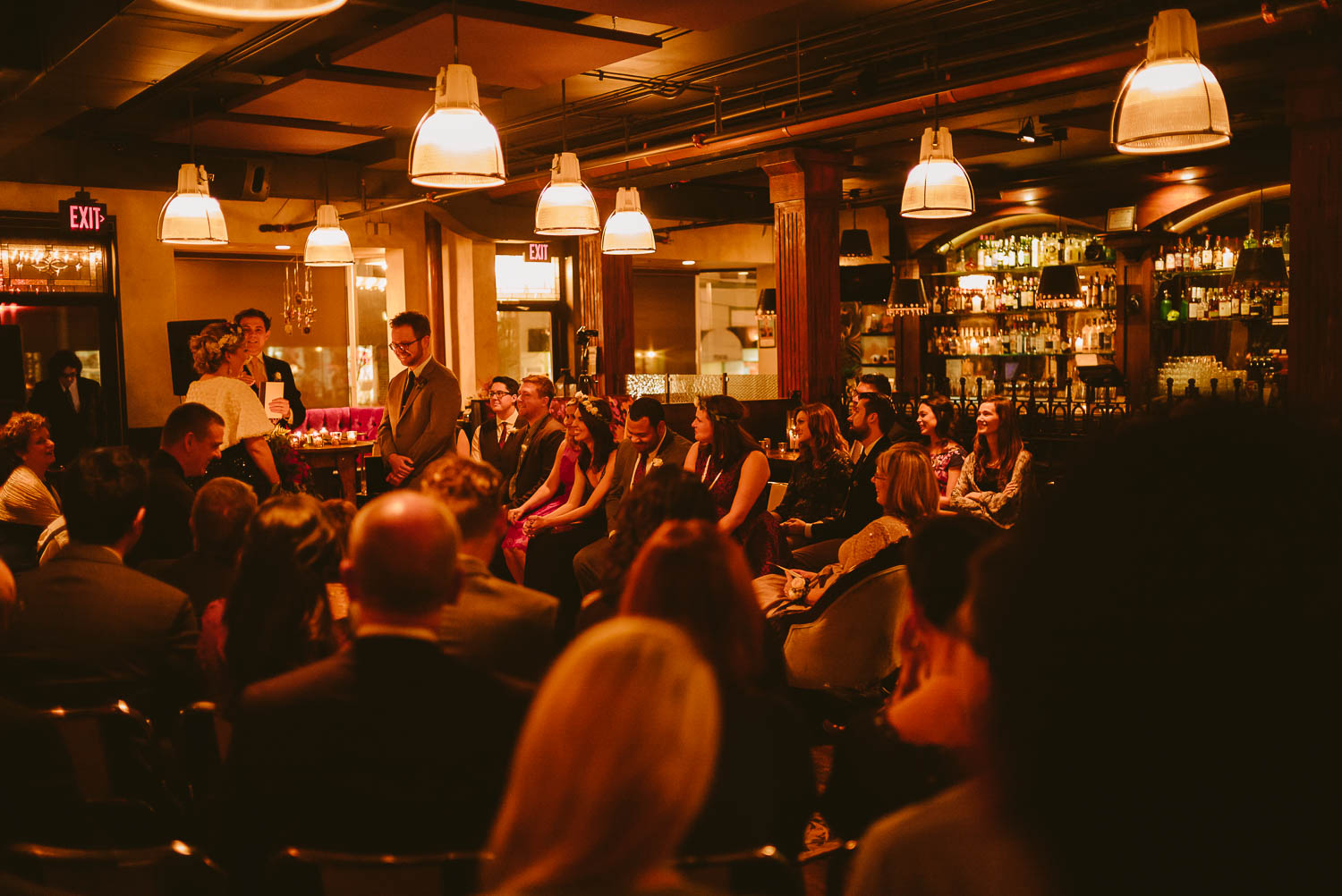 Wide shot of wedding attendees inside republic Takoma Park Washington D.C-Leica Wedding photographer-Philip Thomas