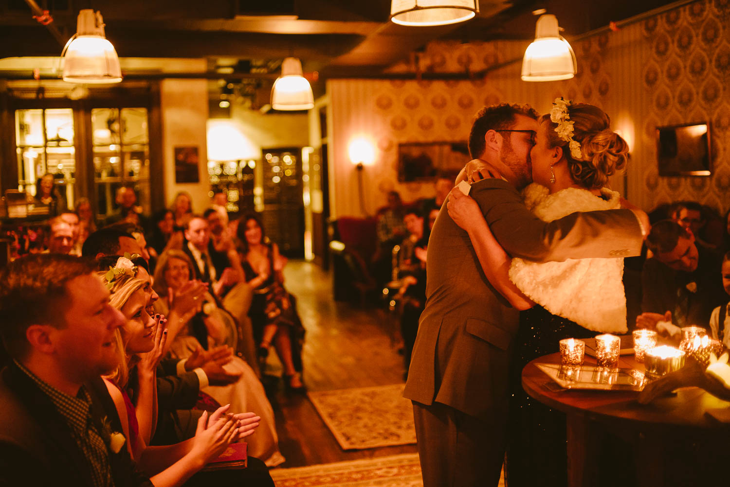 Couple take their first kiss at a wedding ceremony winter wedding in Takoma Park Washington D.C-Leica Wedding photographer-Philip Thomas