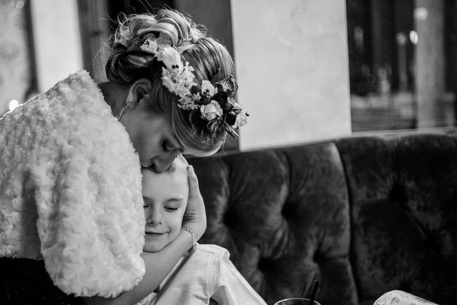 Bride hugs a flower girls at Republic wedding reception Takoma Park Washington D.C-Leica Wedding photographer-Philip Thomas