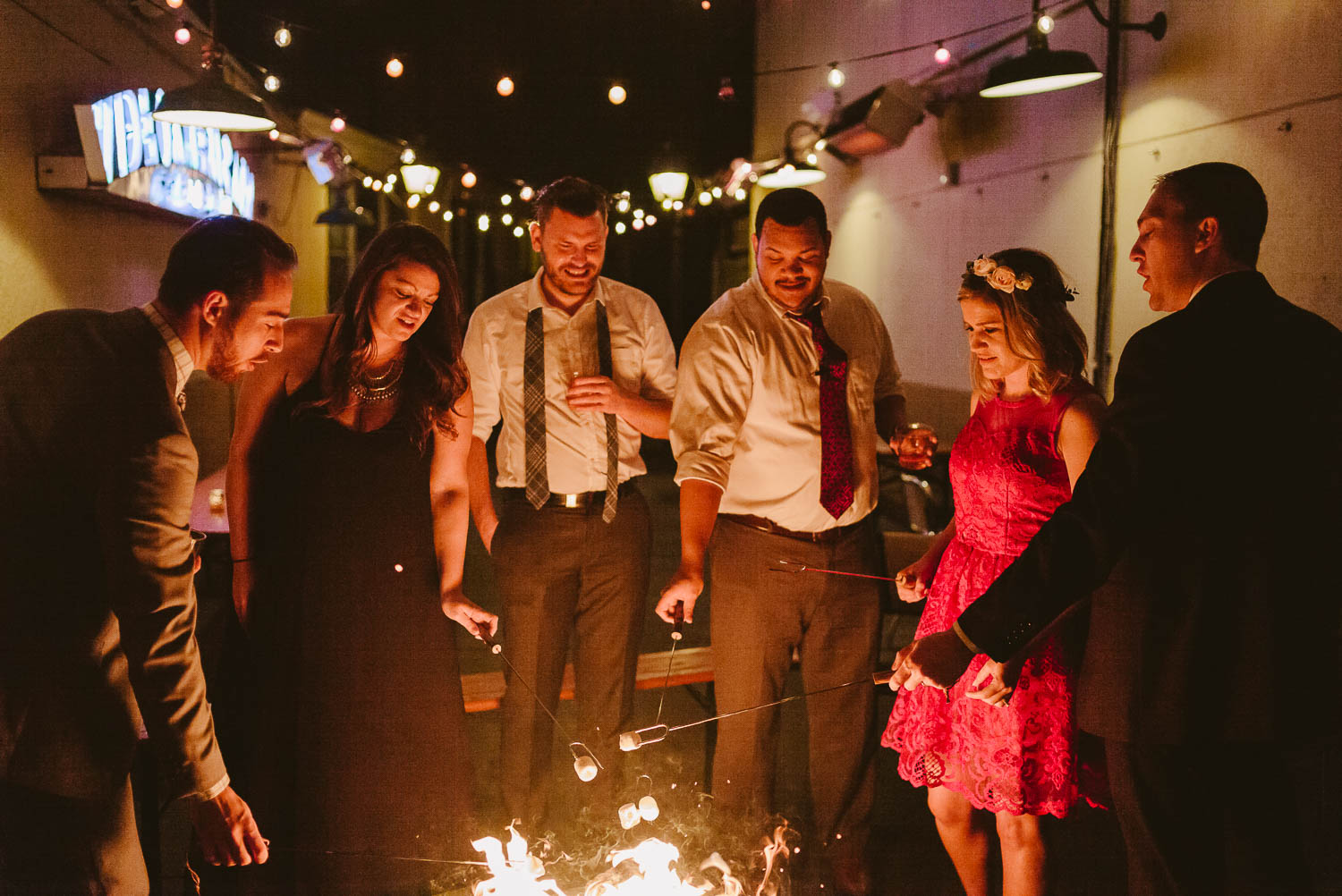 Wedding reception guests at Republic gather roung fire and smores Takoma Park Washington D.C-Leica Wedding photographer-Philip Thomas