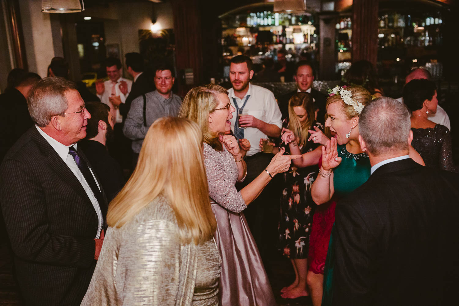 Bride and mother dance together surrounded by friends and family at Republic Takoma Park Washington D.C-Leica Wedding photographer-Philip Thomas