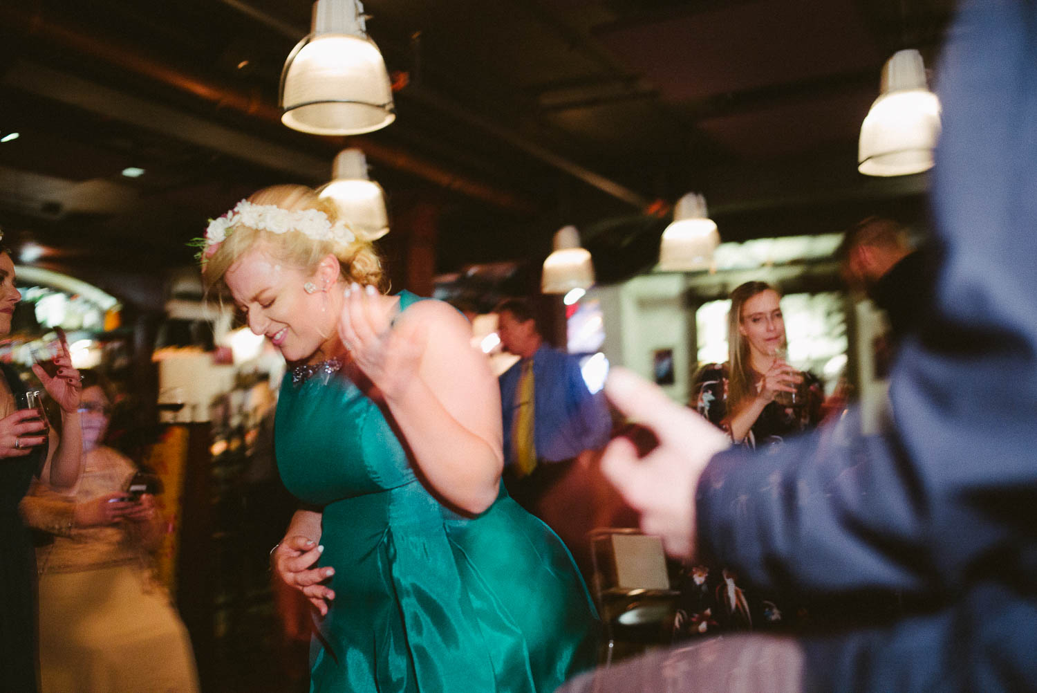 Bride air guitars at wedding reception at Republic Takoma Park Washington D.C-Leica Wedding photographer-Philip Thomas