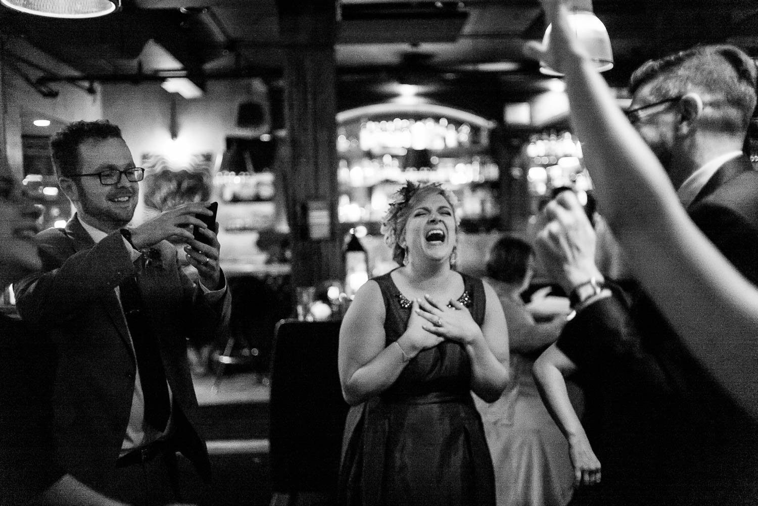Brides laughs out loud at wedding reception Republic Takoma Park Washington D.C-Leica Wedding photographer-Philip Thomas