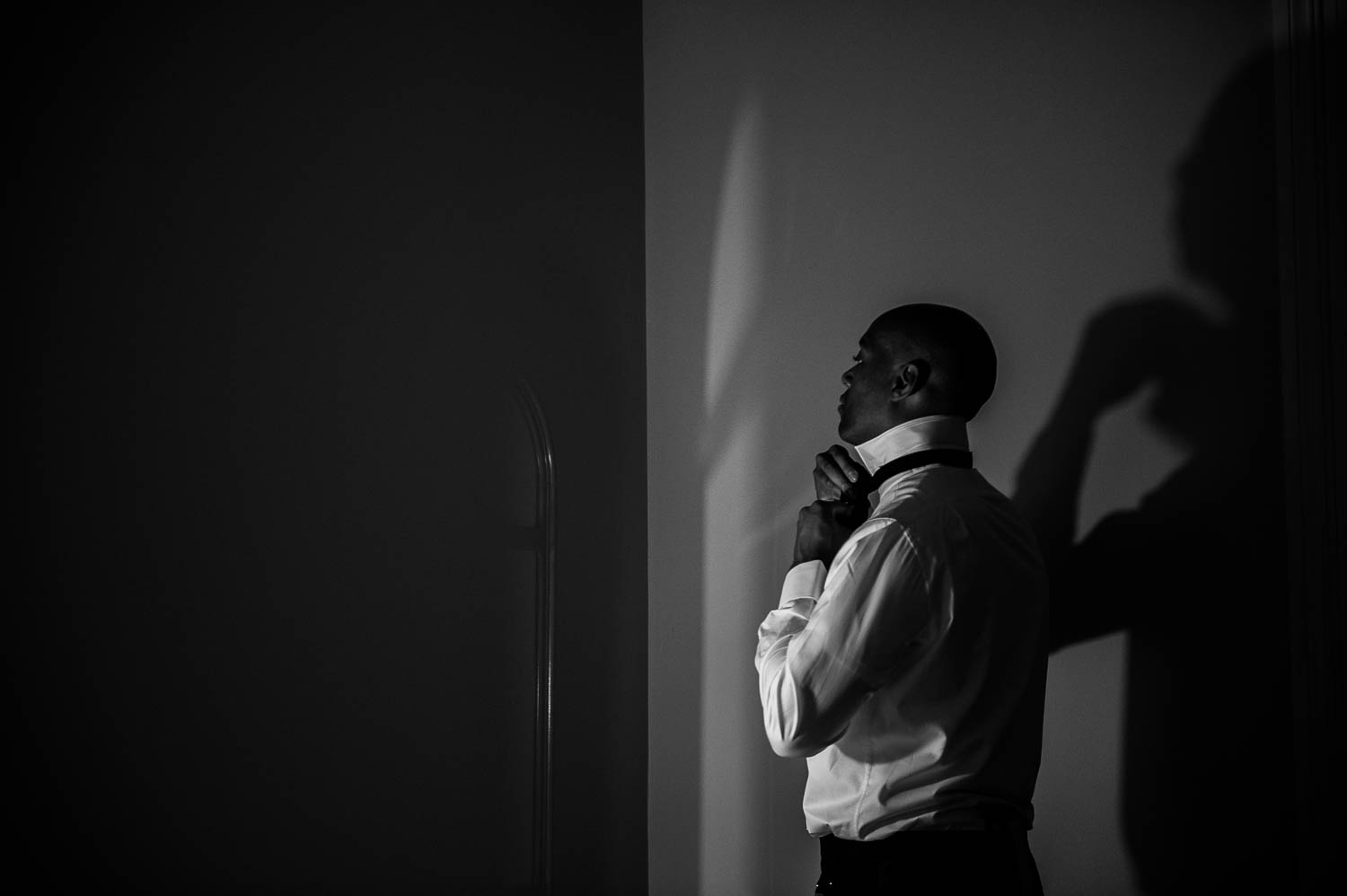 Groom gets ready on his wedding day at the Fairmount, an historical hotel in San Antonio, Texas -Leica photographer-Philip Thomas Photography