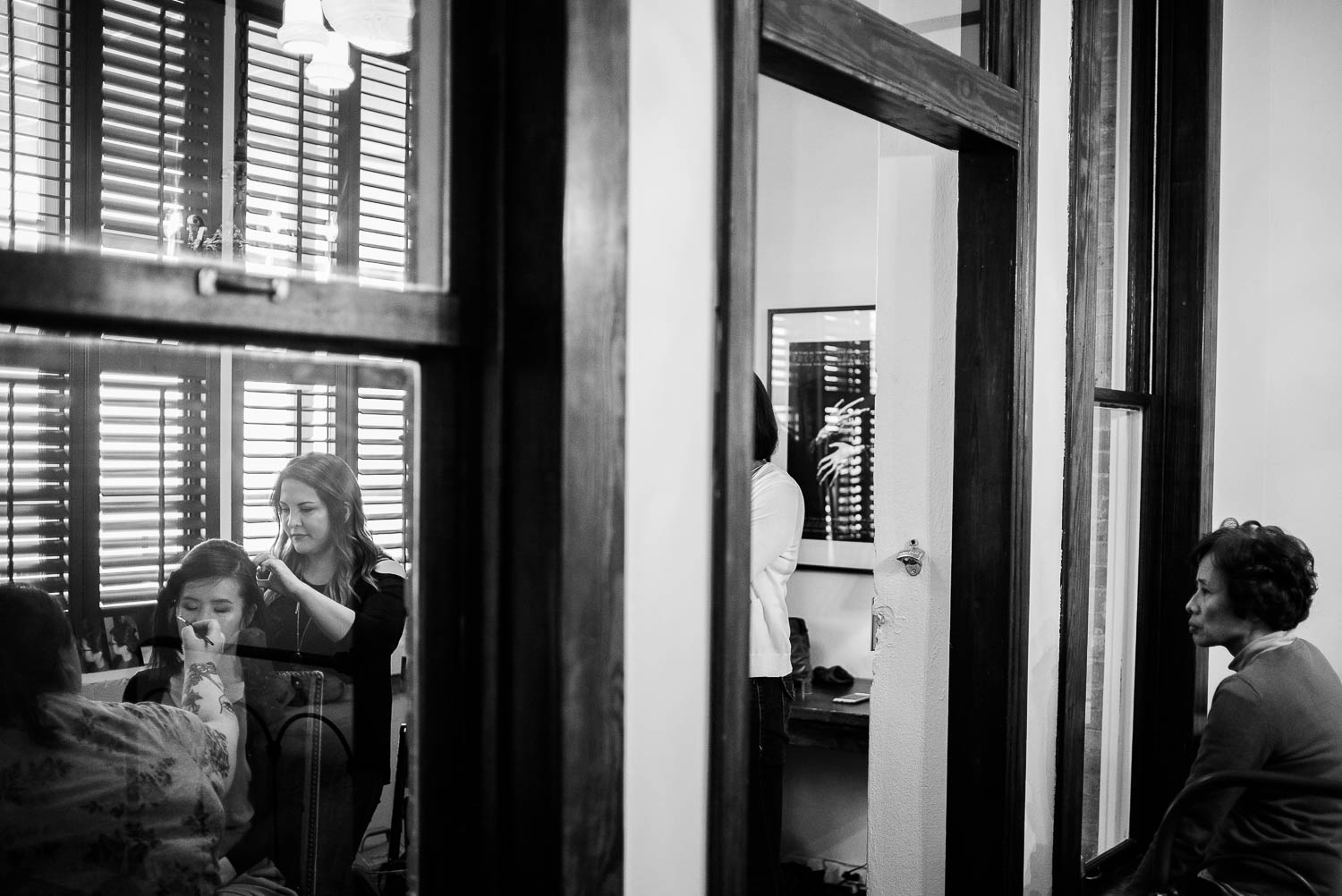 A wide angle shot of bride and mother getting ready in separate rooms at Hotel Havana -Leica photographer-Philip Thomas Photography