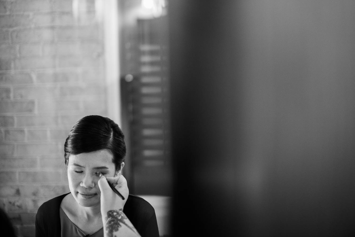 Bride has mascara applied at Hotel Havana Wedding getting ready wedding - Leica photographer-Philip Thomas Photography