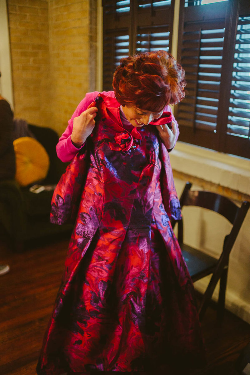 Mother of the bride holds up her dress for the wedding reception at Hotel Havana Wedding getting ready wedding - Leica photographer-Philip Thomas Photography