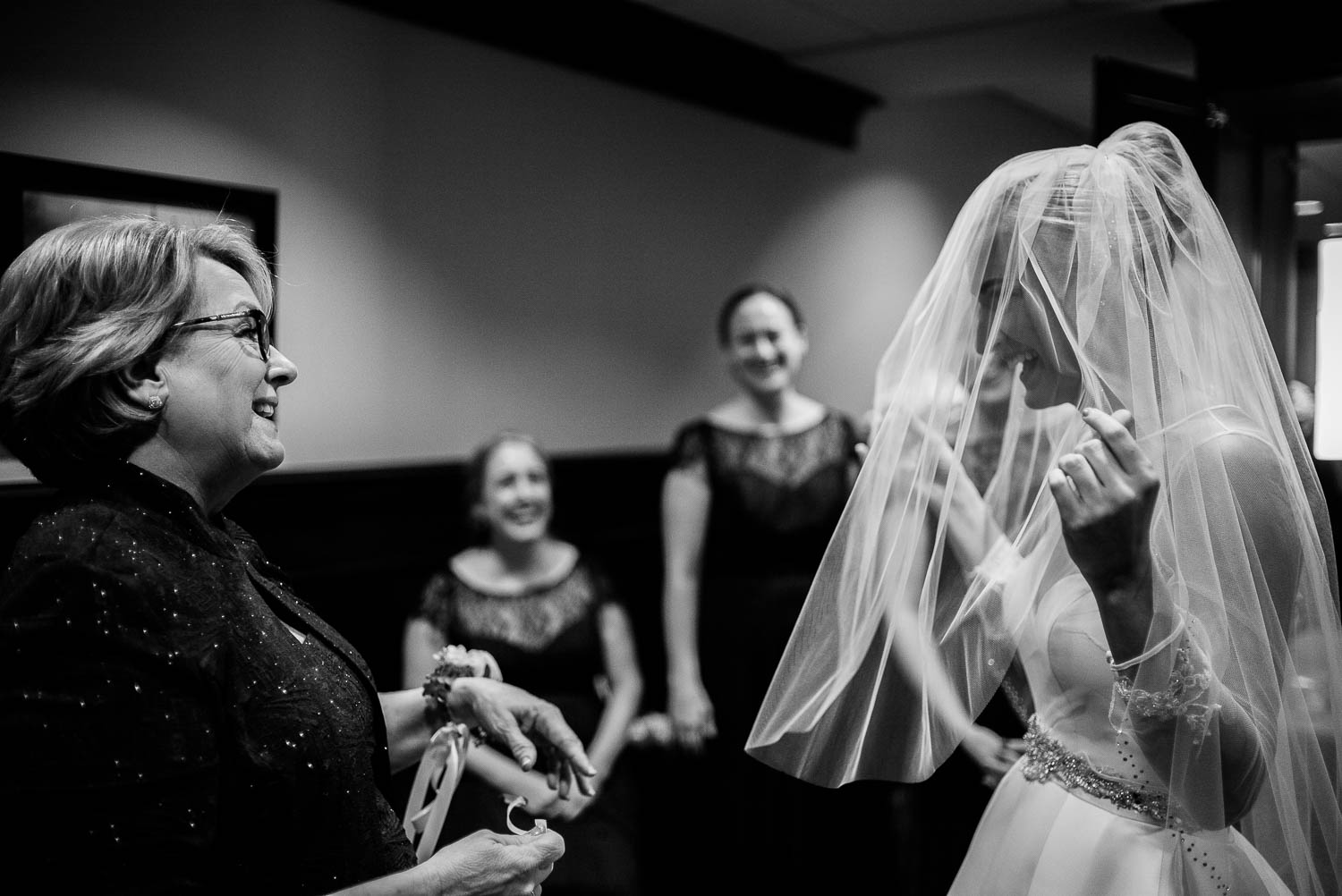Bride fixes veil as her mother reacts with joy at United Methodist Church, Houston Texas.