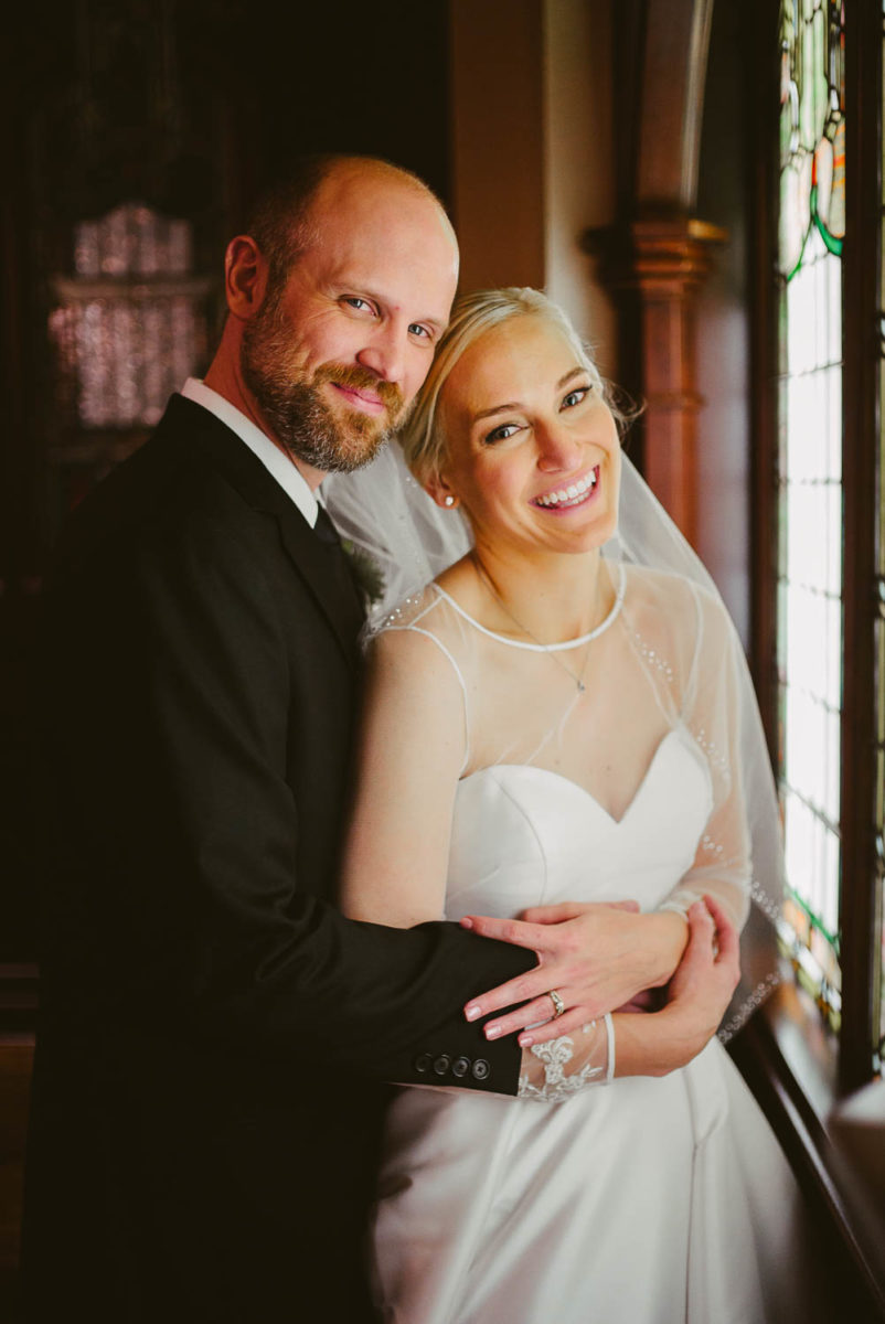 Bride and groom pose by a natural light First United Methodist Church, Houston, Texas