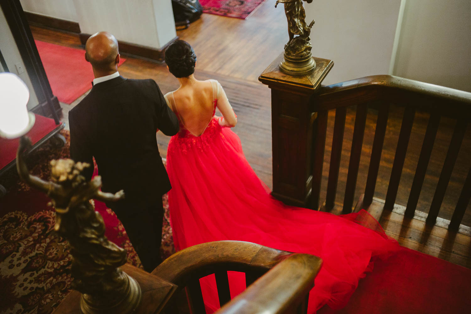 A wedded couple descend staircase at Hotel Havana -Leica photographer-Philip Thomas Photography