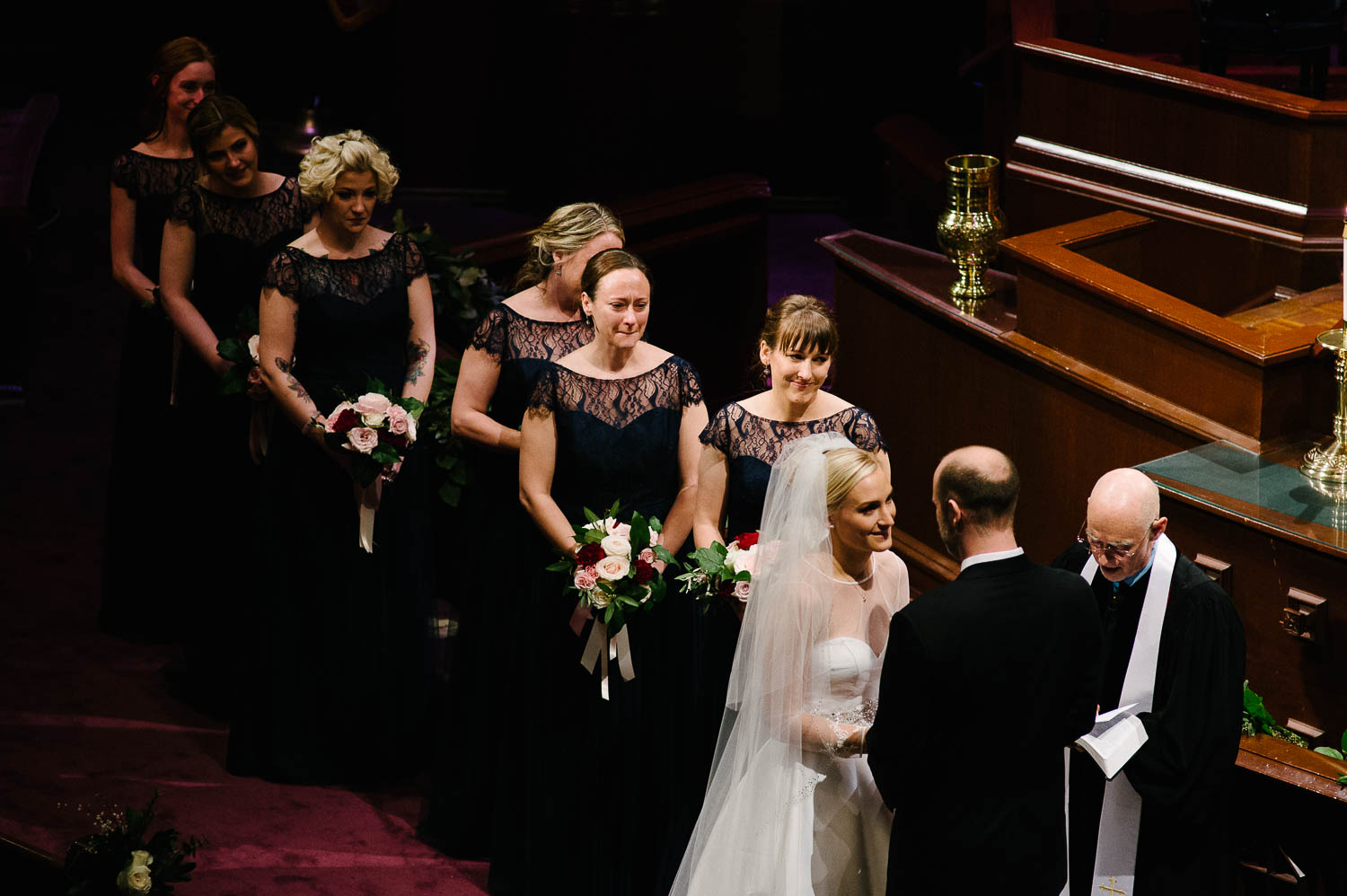 Long shot of couple reciting their vows during a wedding ceremony at irst United Methodist Church Wedding Houston