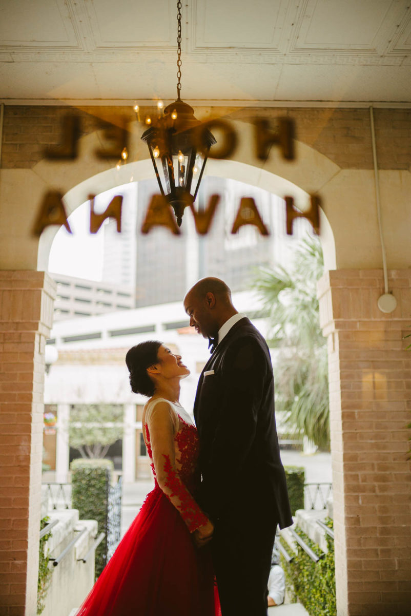 Couple to be married captured through front door of Hotel Havana -Leica photographer-Philip Thomas Photography
