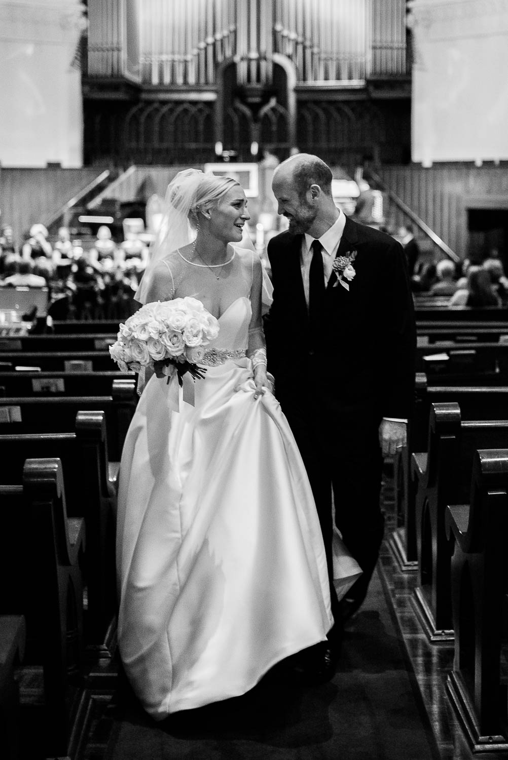 Just married couple walking down the aisle after getting married irst United Methodist Church Wedding Houston