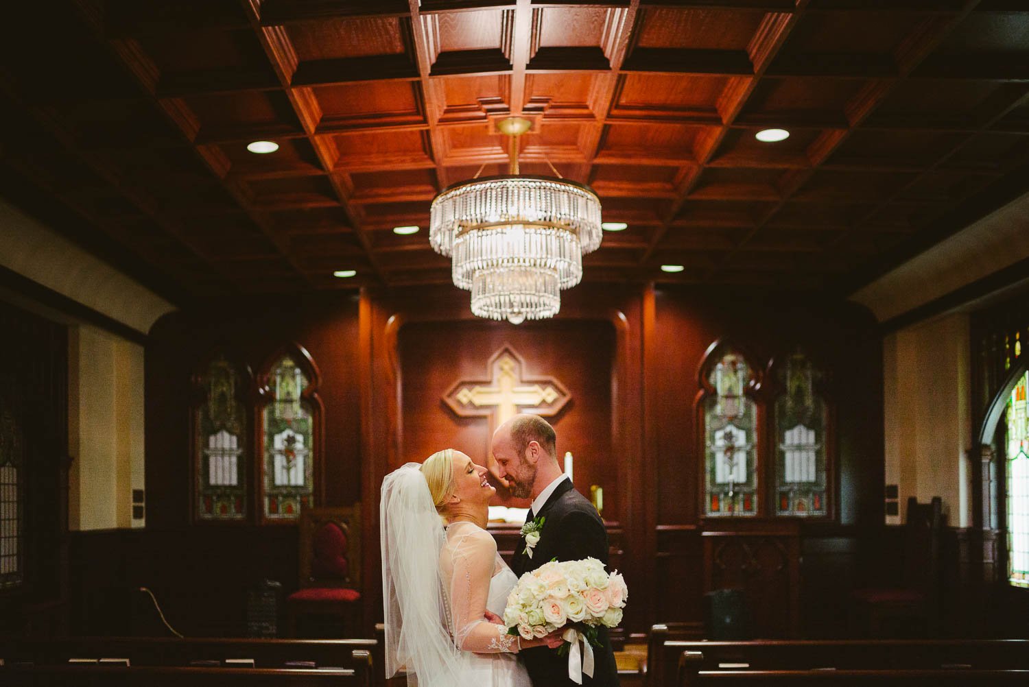 Couple documented hugging in an unposed moment irst United Methodist Church Wedding Houston